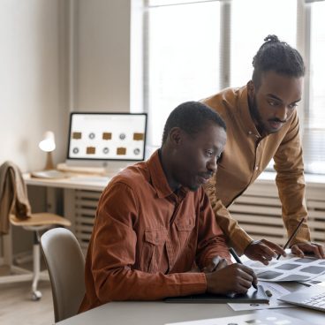 side-view-men-working-together